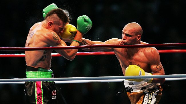 Anthony Mundine (Right)  lands a punch on rival Danny Green (Left)